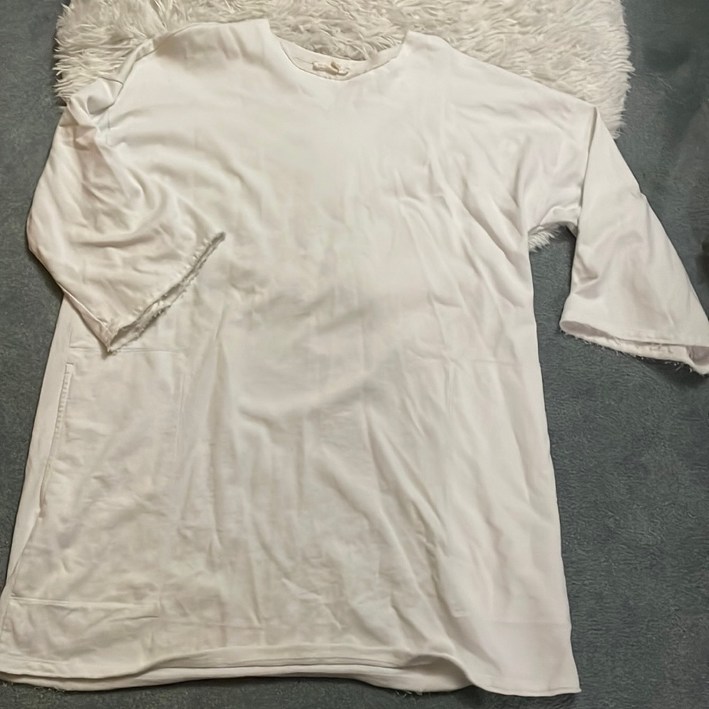 Eileen Fisher smock like shirt. Has pockets. Frayed design. Size M